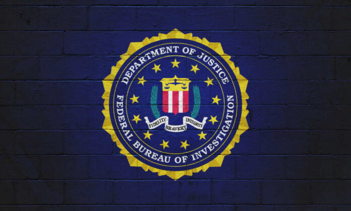 shutterstock_2073117407 FBI emblem on a blue background