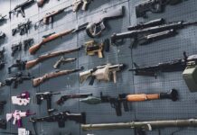 Wall display of assorted firearms and weapons