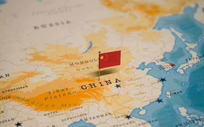 Map of China with a small Chinese flag placed on it