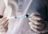 Leaked FDA Memo: Child Deaths Linked to Vaccines? A healthcare professional preparing a syringe from a vial