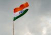 Indian flag waving against a cloudy sky