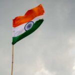 Indian flag waving against a cloudy sky