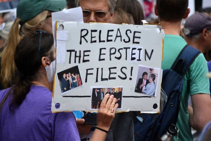 New,York,,New,York,Usa,-,September,1,,2025:,Workers A person holding a protest sign that reads 'Release the Epstein Files!' with photos attached