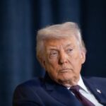 Donald Trump with a serious expression during a media appearance
