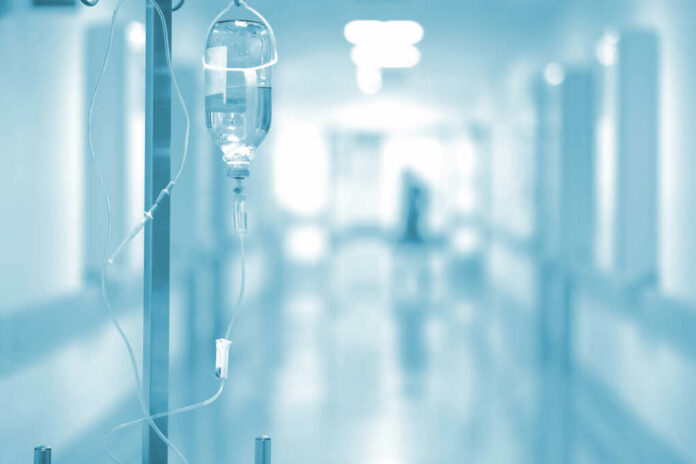 shutterstock_298737923 IV drip in a hospital corridor with a blurred background
