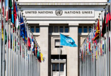Washington Showdown: UN Aid Arm Targeted United Nations building with multiple international flags in front