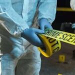 Gunfire At Family Haven—Truth Withheld Forensic investigators in protective suits setting up crime scene tape