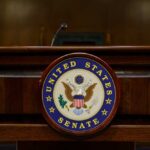 Surveillance Showdown Erupts in Senate Podium with the United States Senate seal in a formal setting