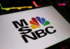 On-Air Meltdown: Trump Walks Close-up of the MSNBC logo displayed on a digital screen