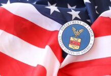 Blue-State Blowback Meets DOJ Heat U.S. Department of Labor seal on an American flag