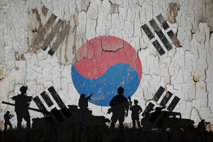South,Korea,Flag,Painted,On,The,Cracked,Wall,And,Soldiers Silhouettes of soldiers in front of the South Korean flag on a cracked wall