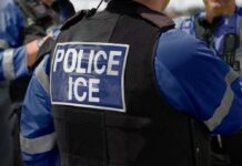 Homicide Ruling Explodes: ICE In The Crosshairs Close-up of a police officer's vest with 'POLICE ICE' label