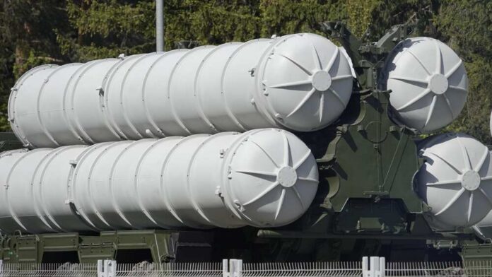 Close-up of a military missile system with cylindrical launchers