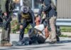ICE Crackdown Boasts—But Where’s The Proof? Police officers apprehending a suspect on the ground