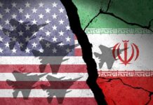 Kharg Island: Quick Win Or Quagmire? A cracked wall featuring the flags of the USA and Iran with military aircraft silhouettes
