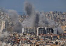 Diplomacy on Edge: Trump Torches Beirut Strike Smoke rising from buildings in a densely populated urban area