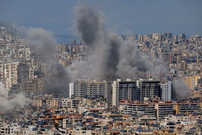 Multiple,Large,Plumes,Of,Thick,Grey,Smoke,Billow,From,Residential Smoke rising from buildings in a densely populated urban area