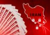 A stack of hundred dollar bills with a map of Iran and padlocks
