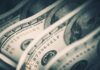Phantom Contractors Exposed — $6B Frozen Close-up of folded hundred dollar bills