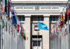 UN Power Play: Iran Boxes In Washington United Nations building with multiple international flags in front