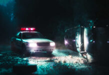 Baby Ejected In Chaotic Police Chase A police car with flashing lights at the scene of a flipped vehicle accident