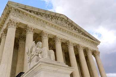 2173350561 Supreme Court building with columns and statue
