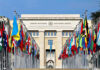 France Brands U.S. ‘North Korea’ Ally United Nations building with numerous national flags outside.