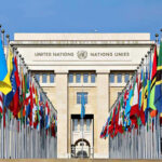 France Brands U.S. ‘North Korea’ Ally United Nations building with numerous national flags outside.