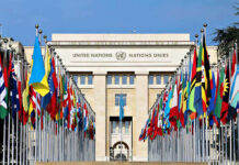 France Brands U.S. ‘North Korea’ Ally United Nations building with numerous national flags outside.