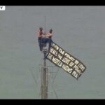 Empire State Drama: Love vs Power Two people climb Empire State Building