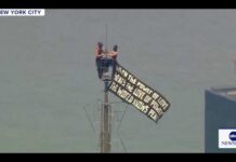 Empire State Drama: Love vs Power Two people climb Empire State Building
