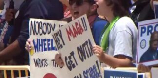 Hundreds turn out to protest Trump's visit to Marietta high school