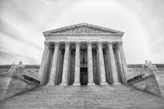 U.s,,Supreme,Court,Building Front view of the Supreme Court building with columns and statues