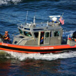 Repeat Crash Mystery Grips East River U.S. Coast Guard boat navigating through water