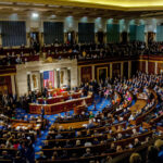 Birthright Bombshell: Johnson Sparks Constitutional Brawl A large gathering of officials in a congressional chamber during a legislative session