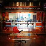 CNN studio set with empty anchor desk and red chair