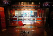 Trump Declassifies — CNN Shifts Framing CNN studio set with empty anchor desk and red chair