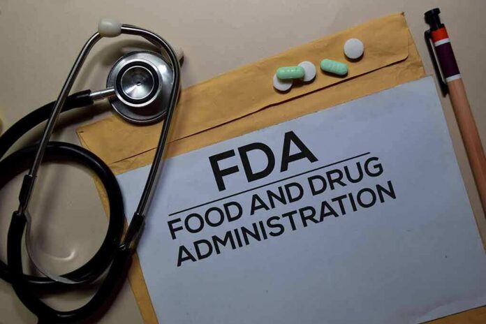 shutterstock_1606720699 FDA document with stethoscope, pills, and pencil on envelope