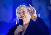 Terror Flip Stuns Widdecombe Probe Older woman speaking with microphone, hand raised