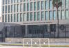 Immunity Wall Stops NYC Power Play Embassy building behind tall black security fence