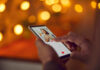 South Florida Love Hustle Exposed Person using a smartphone to interact with a dating app
