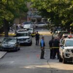 Mattapan Shock At Congresswoman’s Rental Police officers secure a residential street with patrol cars and yellow tape