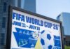 FIFA Loophole Lets US Star Play FIFA World Cup 26 poster with soccer ball in urban setting