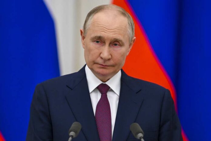 Russian,President,Vladimir,Putin,Made,Statements,At,A,Joint,Press A serious-looking political figure at a press conference with national flags in the background
