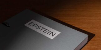 A metallic folder labeled 'EPSTEIN' resting on a wooden surface