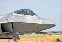 Fighter jet cockpit and nose close-up on runway