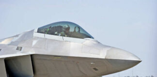 Fighter jet cockpit and nose close-up on runway