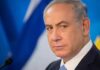 SHOCKING Ultimatum To Iran’s Rulers man in suit at podium