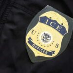 Sanctuary Standoff Sparks Risky Street Busts ICE officer badge on a dark uniform