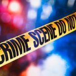 Horrific Mom Case Shocks North Dakota yellow crime scene tape with blurred police lights